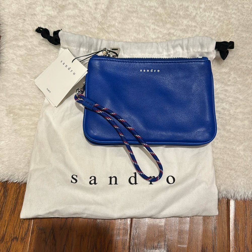 Blue pouch leather wristlet 2 compartments Sandro. Never worn.